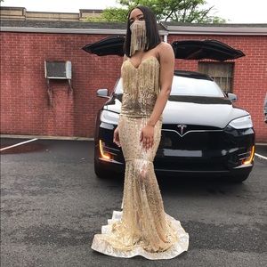 Custom made dress. Gold. Worn once for a few hours. Long with no sleeves.